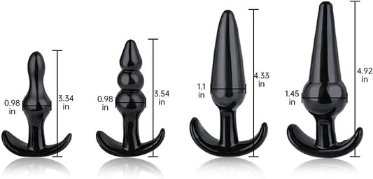 A set of four black anal plugs of varying sizes, each with a different shape designed for anal stimulation.