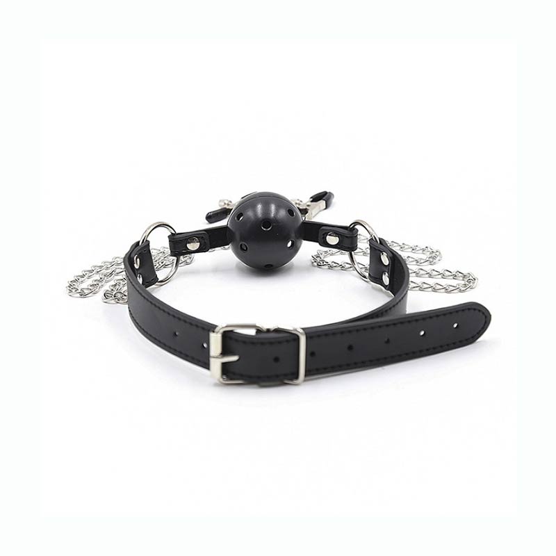 A black mouth gag and nipple clamps set, featuring a ball gag with a leather strap and a chain connecting to the clamps. The clamps are adjustable and have a metallic finish.